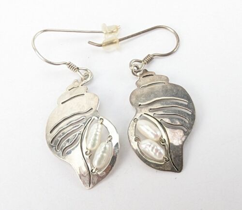 Wild Bryde Conch Earrings Full-Body, Hallmark Photo, Species Photo - Unofficial Wild Bryde Collector's Guide